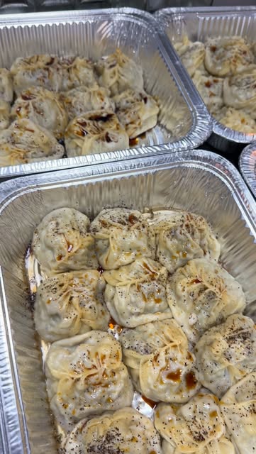 Trays of freshly steamed manti dumplings